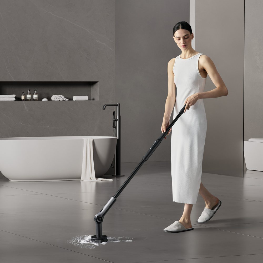 HOTO electric scrubber cleaning a bathroom floor